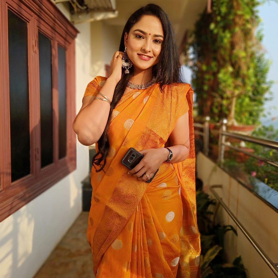 Telugu Tv Anchor Kasi Annapurna Stills in Orange Saree